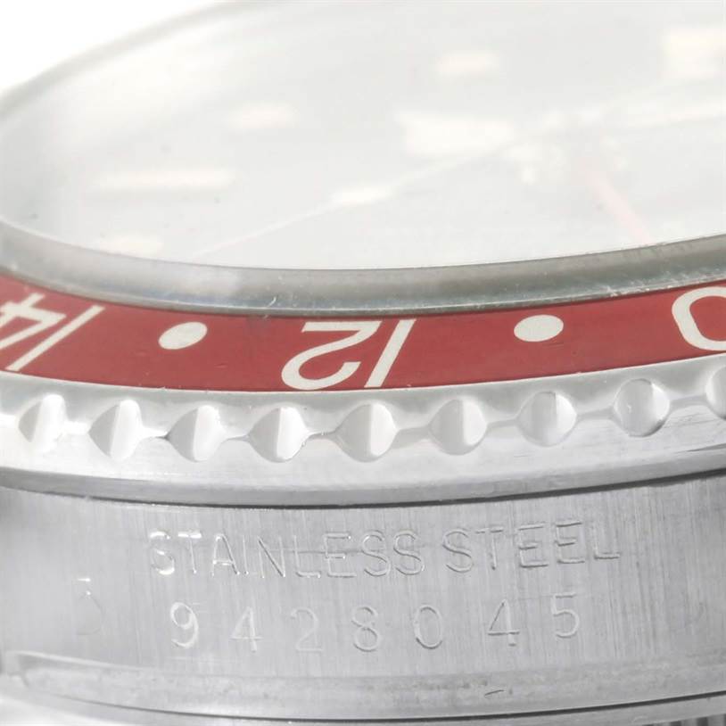 The image shows a close-up of the bezel and case side of a Rolex Vintage Collection 16760 Stainless Steel Black Dial 16760 Stainless Steel Black Dial watch, highlighting its stainless steel construction and partial serial number.