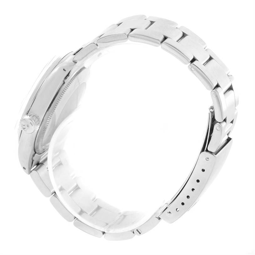 The image shows a side view of the Rolex Vintage Collection 1500 Men's Stainless Steel Silver Dial 1500 Men's Stainless Steel Silver Dial watch, highlighting its bracelet and crown.