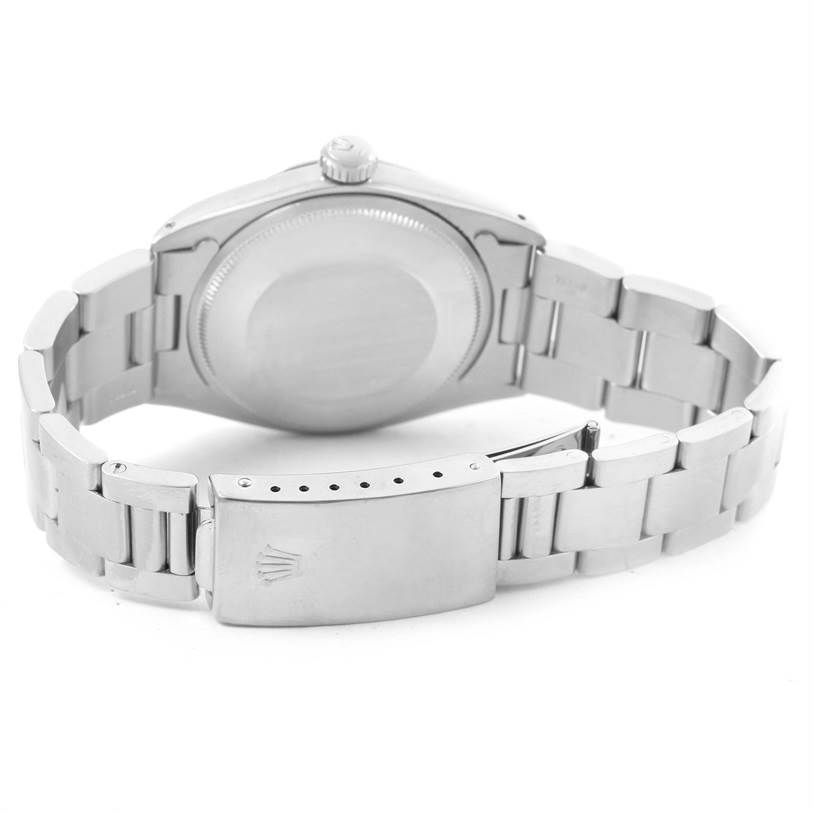 This image shows the back and clasp of the Rolex Vintage Collection 1500 Men's Stainless Steel Silver Dial 1500 Men's Stainless Steel Silver Dial watch at a low-angle view of its metal bracelet.