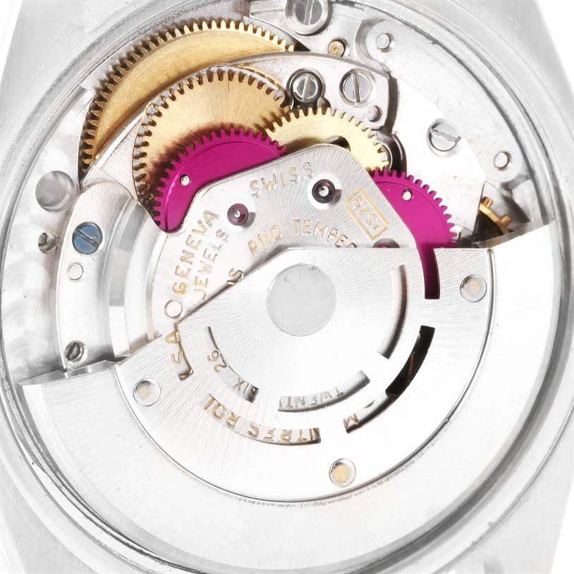 The image shows the internal mechanism of a Vintage Collection model by Rolex, highlighting gears and rotors.