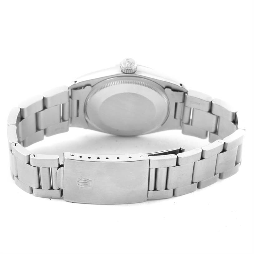 The image shows the back case and bracelet clasp of a Vintage Collection model Rolex watch.