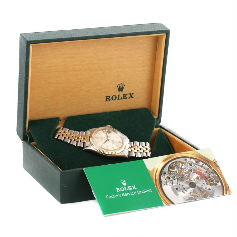 The Rolex Vintage Collection 1601 Men's Stainless Steel Silver Dial 1601 Men's Stainless Steel Silver Dial model is displayed in an open box with its factory service booklet in front.