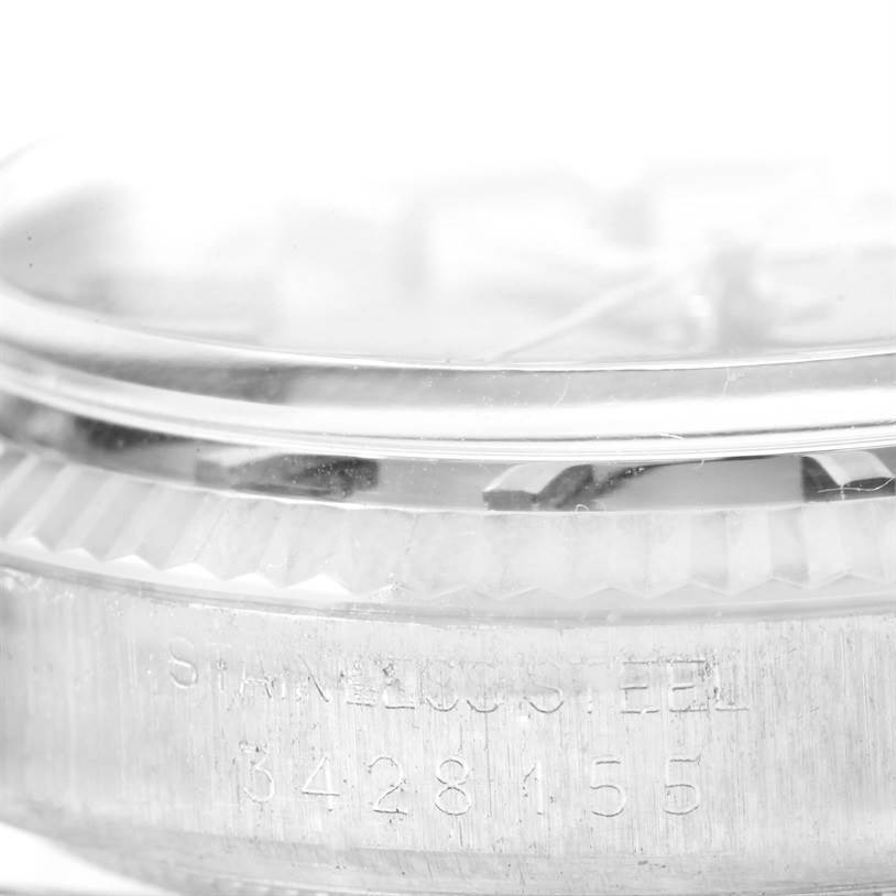 The image shows a close-up side angle of a Rolex Vintage Collection 1601 Men's Stainless Steel Blue Dial 1601 Men's Stainless Steel Blue Dial watch's case, bezel, and part of the crystal.