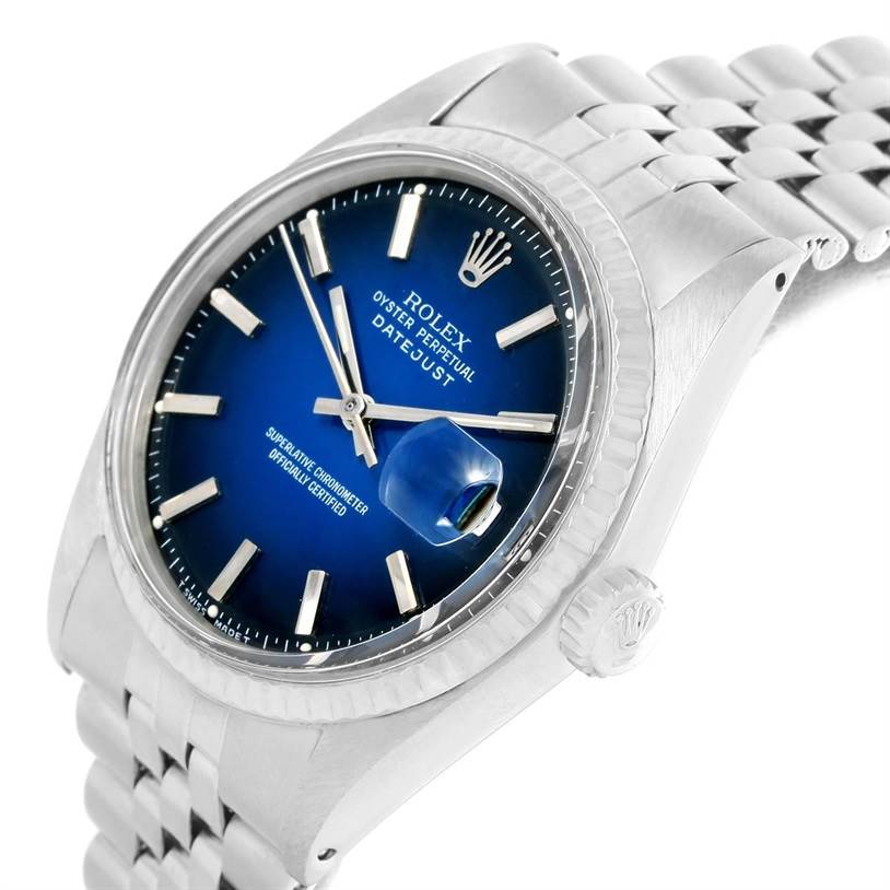 This image shows a Rolex Vintage Collection 1601 Men's Stainless Steel Blue Dial 1601 Men's Stainless Steel Blue Dial Datejust watch at an angle, highlighting its blue dial, fluted bezel, and jubilee bracelet.
