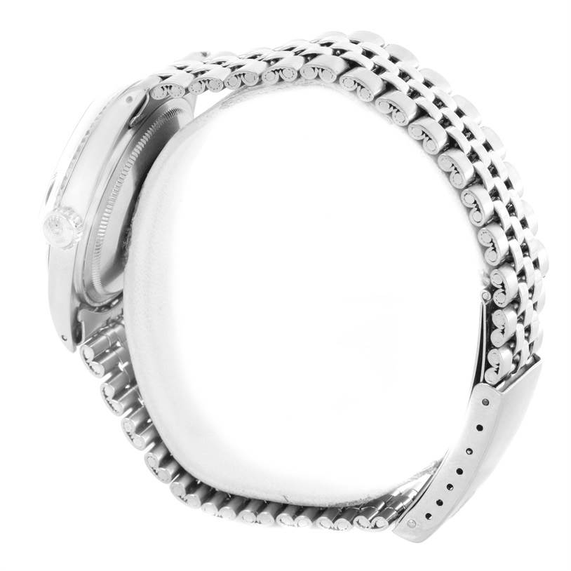 The image shows a side view of the Rolex Vintage Collection 1601 Men's Stainless Steel Blue Dial 1601 Men's Stainless Steel Blue Dial watch, highlighting the crown and the bracelet.