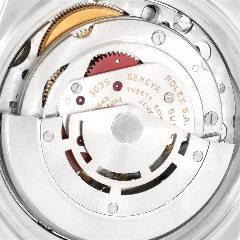 The image shows the internal movement mechanism of a Rolex Vintage Collection 16014 Men's Stainless Steel Silver Dial 16014 Men's Stainless Steel Silver Dial model, focusing on gears and the rotor.