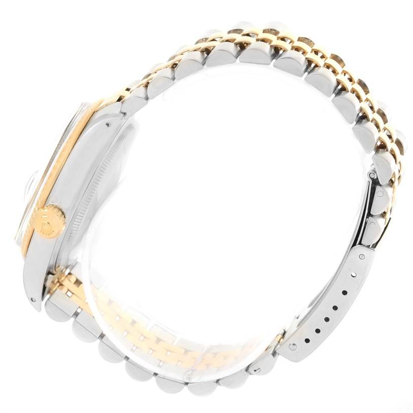 This image shows a side view of the Rolex Vintage Collection 16013 Men's Stainless Steel White Dial 16013 Men's Stainless Steel White Dial watch, highlighting the crown and metal bracelet.