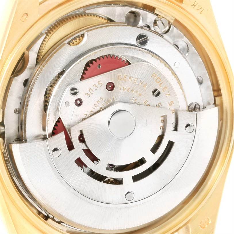 The image shows a close-up view of the movement and inner mechanism of the Vintage Collection Rolex watch.