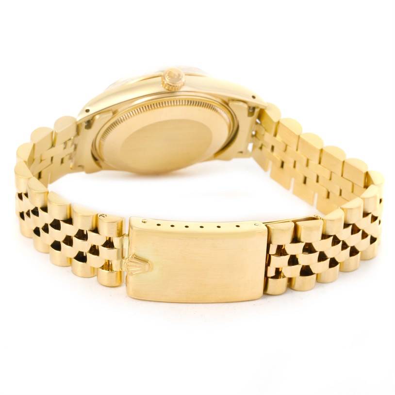 The image shows the back and clasp of the Rolex Vintage Collection 15037 Men's Yellow Gold Blue Dial 15037 Men's Yellow Gold Blue Dial watch, highlighting the golden bracelet and case.