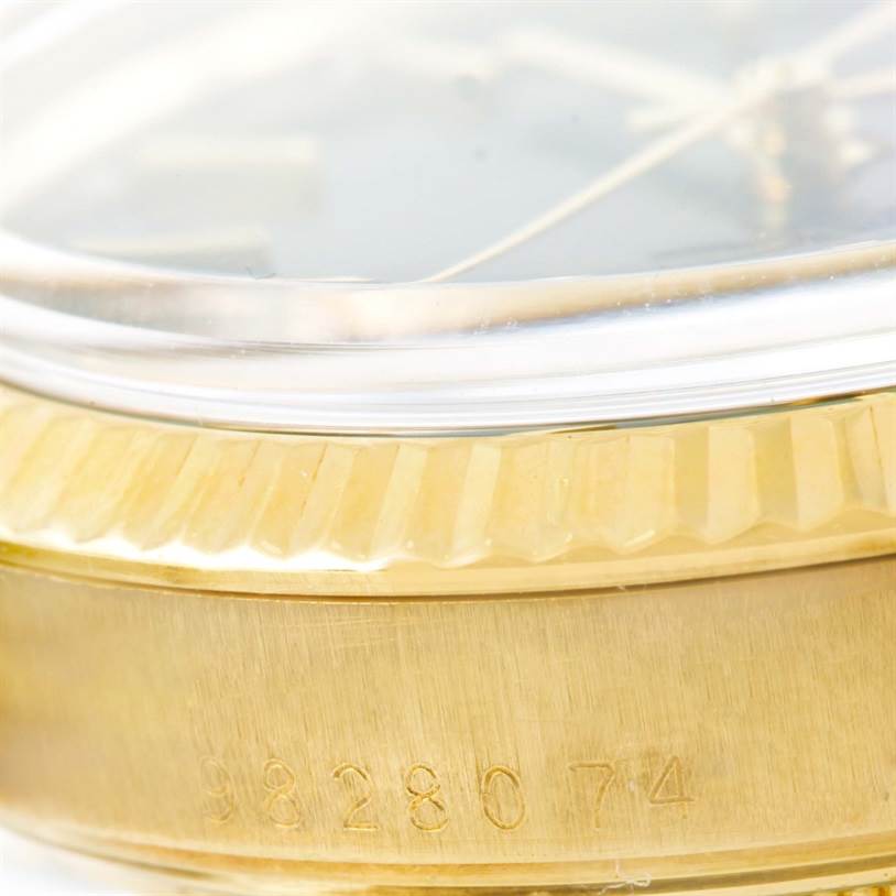 This image shows a close-up of the case side and bezel of a Rolex Vintage Collection 15037 Men's Yellow Gold Blue Dial 15037 Men's Yellow Gold Blue Dial model watch.