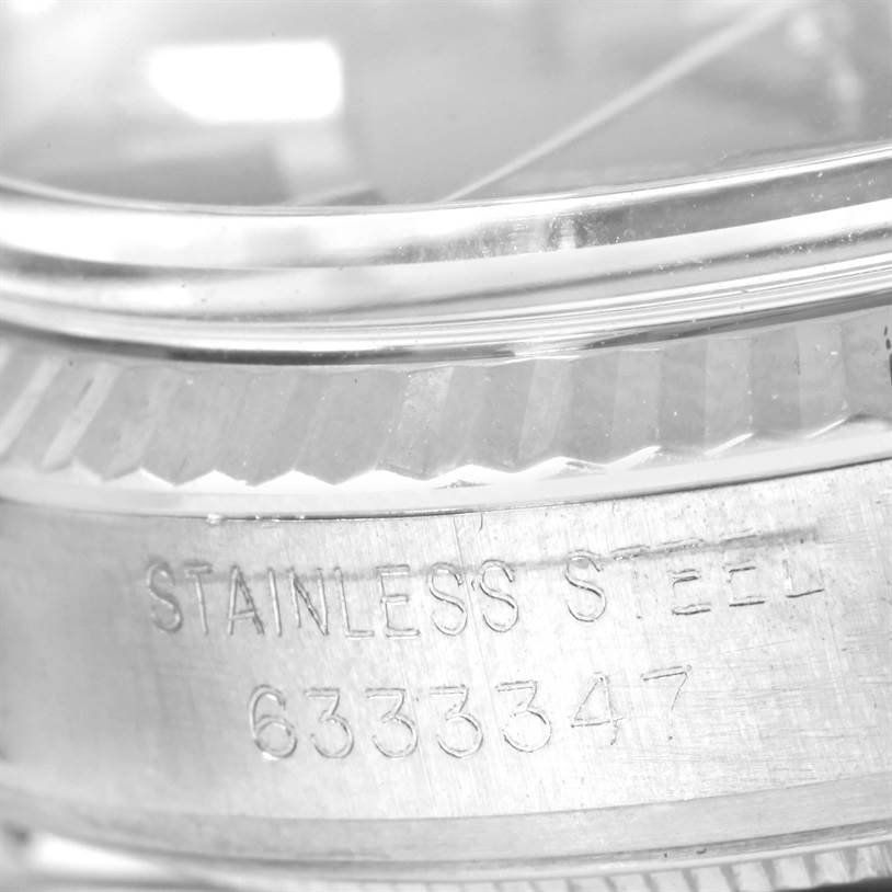 The image shows a close-up view of the stainless steel casing and serial number on a Vintage Collection model by Rolex.