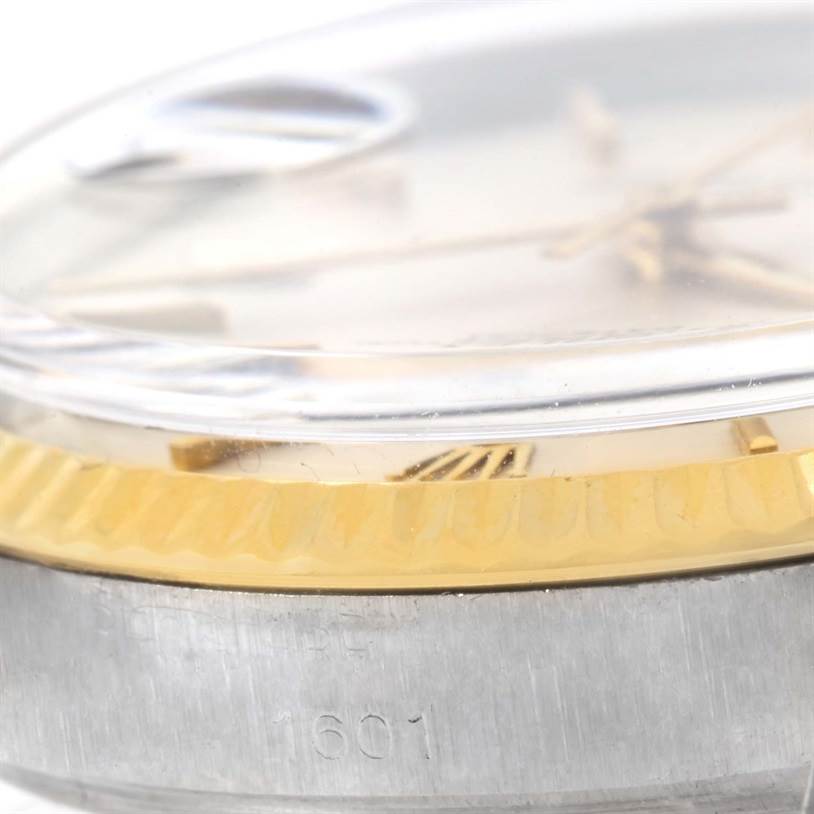 This close-up image shows the side view of the Rolex Vintage Collection 1601 Men's Stainless Steel Silver Dial 1601 Men's Stainless Steel Silver Dial model, highlighting the serial number "1601" and crystal.