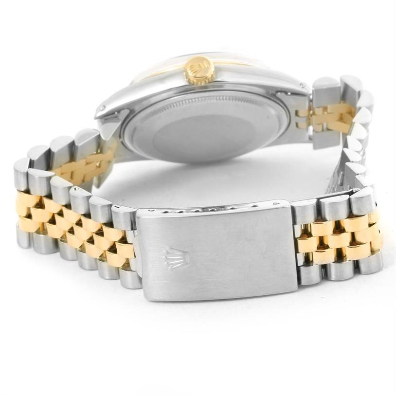 The image shows the back and side view of a Vintage Collection Rolex watch, focusing on the clasp and bracelet.