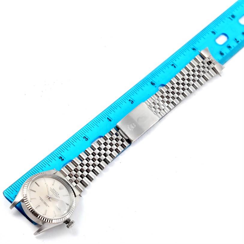 The image shows a Rolex Vintage Collection 16014 Men's Stainless Steel Silver Dial 16014 Men's Stainless Steel Silver Dial watch laid flat next to a ruler, displaying the face, crown, and metal bracelet.