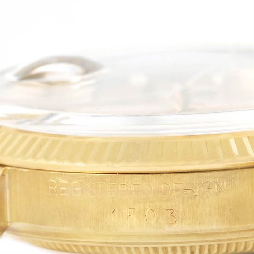 The image shows a close-up of the side of the case and the edge of the crystal of a Vintage Collection Rolex watch.