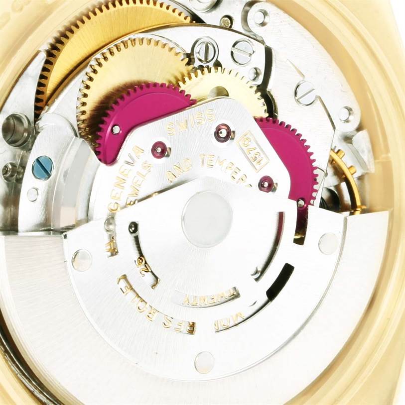 This close-up image shows the internal mechanical parts of a Rolex Vintage Collection 1503 Men's Yellow Gold Champagne Dial 1503 Men's Yellow Gold Champagne Dial watch, including gears and components.