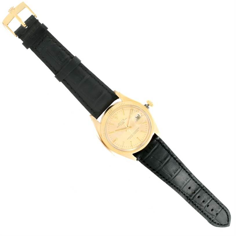 The image shows a top view of the Rolex Vintage Collection 1503 Men's Yellow Gold Champagne Dial 1503 Men's Yellow Gold Champagne Dial watch, displaying the face, bezel, and leather strap.