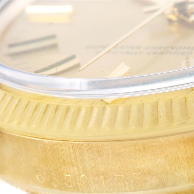 The image shows a close-up angle of the Rolex Vintage Collection 1503 Men's Yellow Gold Champagne Dial 1503 Men's Yellow Gold Champagne Dial watch, highlighting the bezel, part of the dial, and the case serial number.