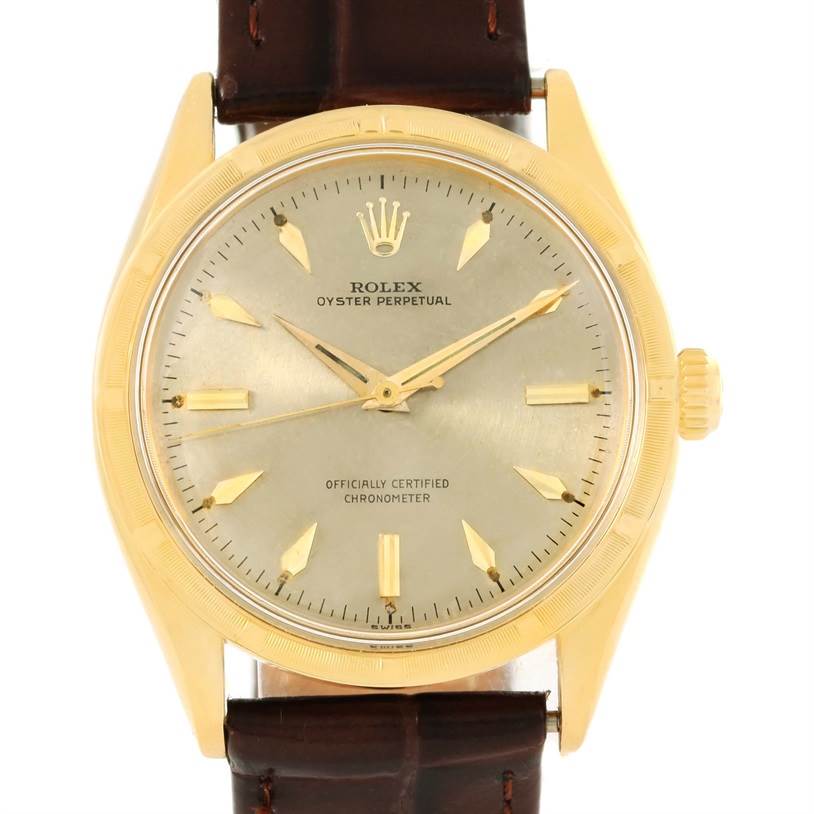 This image shows a Rolex Vintage Collection 6569 Men's Yellow Gold Brown Dial 6569 Men's Yellow Gold Brown Dial model watch from a front angle, highlighting the dial, hands, and brown leather strap.