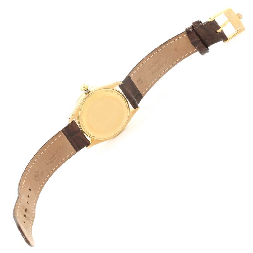 The image shows the back view of a Rolex Vintage Collection 6569 Men's Yellow Gold Brown Dial 6569 Men's Yellow Gold Brown Dial watch, including the strap and buckle.
