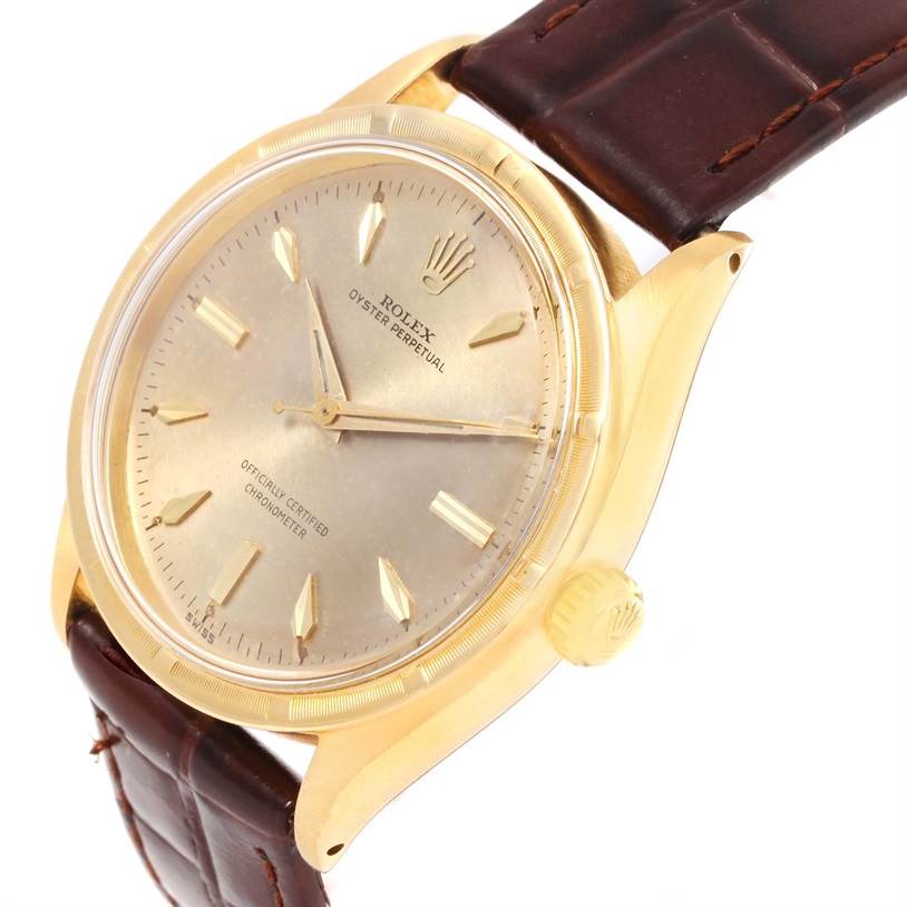 The image shows a front-side angle of the Rolex Vintage Collection 6569 Men's Yellow Gold Brown Dial 6569 Men's Yellow Gold Brown Dial model, highlighting the dial, hands, case, and brown leather strap.