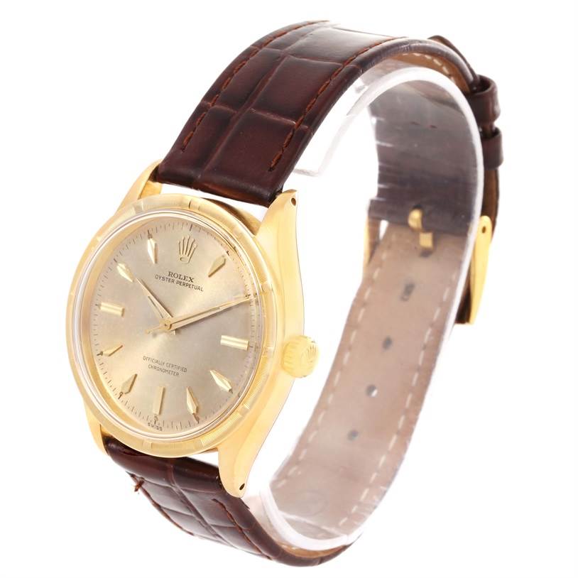 The Rolex Vintage Collection 6569 Men's Yellow Gold Brown Dial 6569 Men's Yellow Gold Brown Dial watch is shown at a slight left angle, displaying the dial, case, bezel, crown, and brown leather strap.