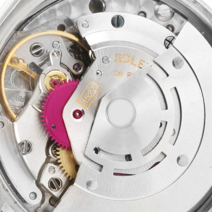 This image shows the intricate internal mechanism of a Vintage Collection model by Rolex, highlighting gears and rotors.