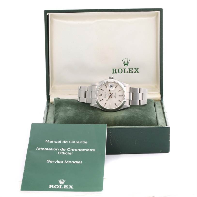 The Rolex Vintage Collection 6694 Men's Stainless Steel Silver Dial 6694 Men's Stainless Steel Silver Dial watch is displayed front-on in an open box, accompanied by a warranty manual and official certification.