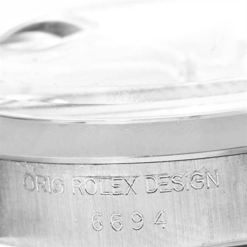 The image shows a close-up of the case side and bezel from the Vintage Collection model by Rolex, displaying the model number "6694".