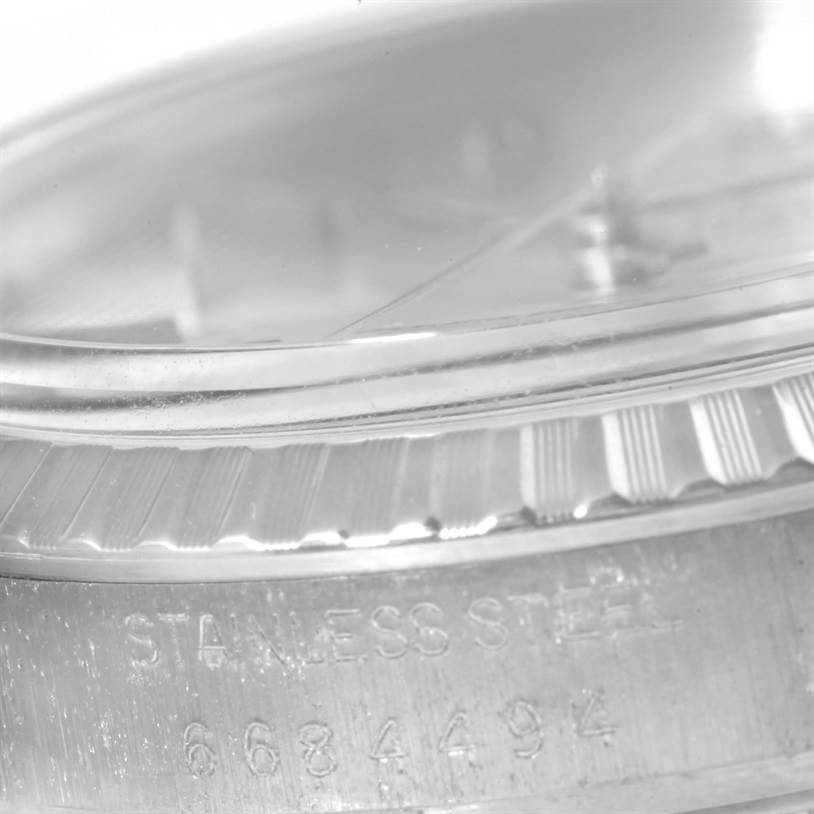 This close-up angle of the Rolex Vintage Collection 16030 Men's Stainless Steel Silver Dial 16030 Men's Stainless Steel Silver Dial model shows the bezel, watch face edge, and part of the engraved casing.