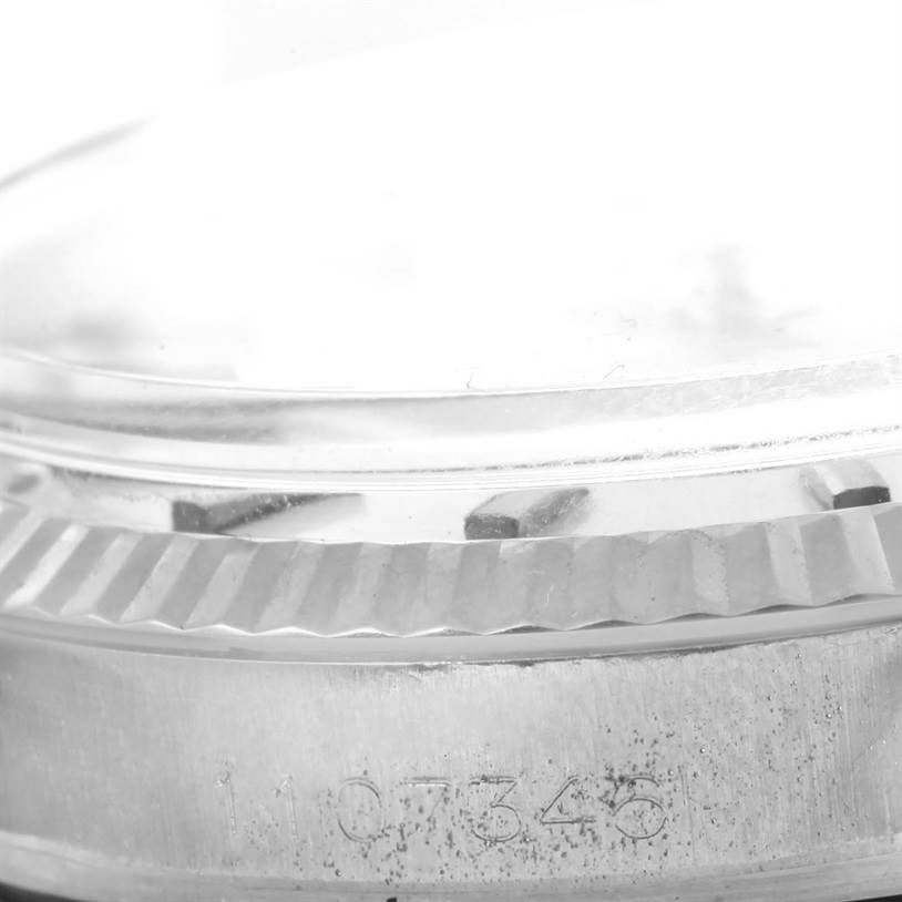 Close-up side view of the bezel and crown edge of a Rolex Vintage Collection 1601 Men's Stainless Steel Silver Dial 1601 Men's Stainless Steel Silver Dial model watch.