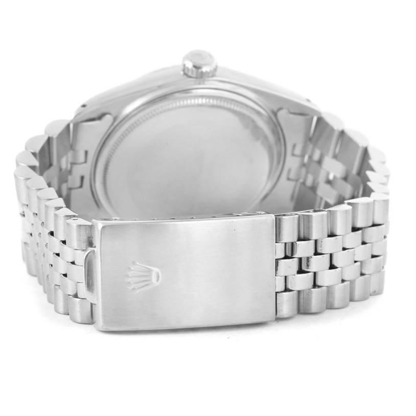 This image shows the back case and metal bracelet clasp of a Vintage Collection Rolex watch.