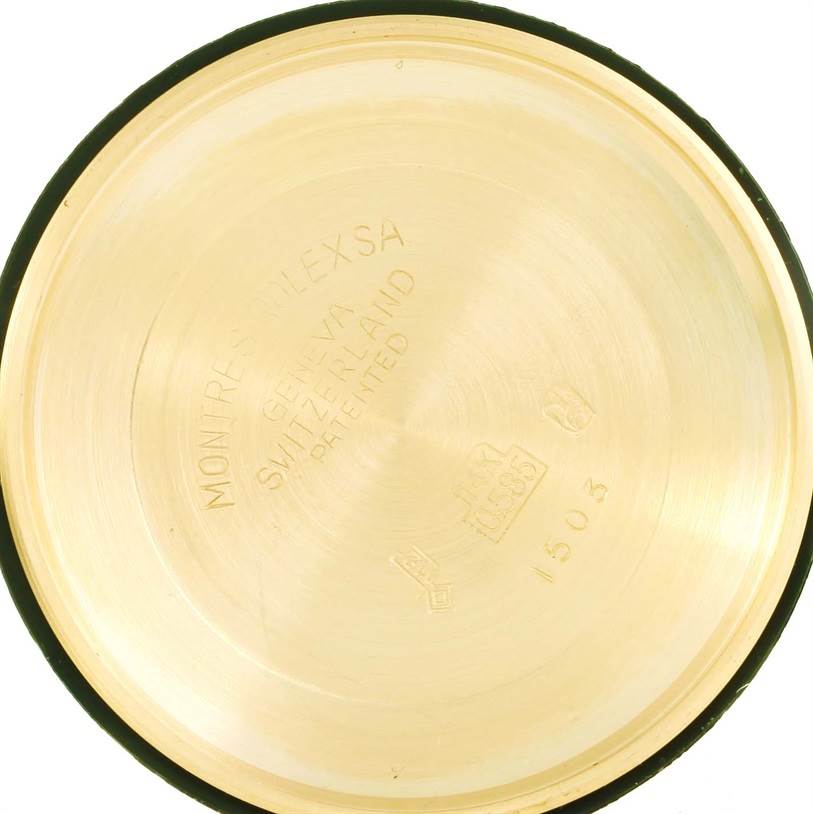 This is the interior view of the case back of a Vintage Collection model by Rolex, showing inscriptions and markings.