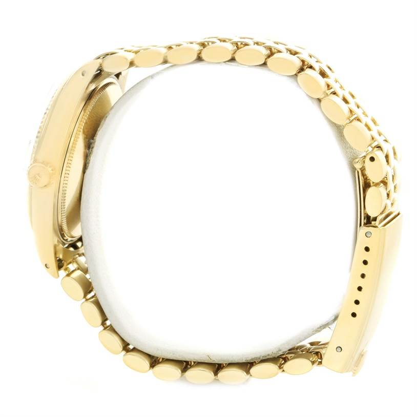 The image shows the side view of a Rolex Vintage Collection 1503 Men's Yellow Gold Silver Dial 1503 Men's Yellow Gold Silver Dial watch, focusing on the case and the bracelet.