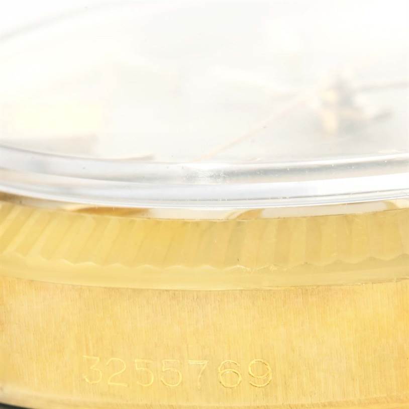 This close-up shows the serial number and side profile of the Rolex Vintage Collection 1503 Men's Yellow Gold Silver Dial 1503 Men's Yellow Gold Silver Dial watch case.