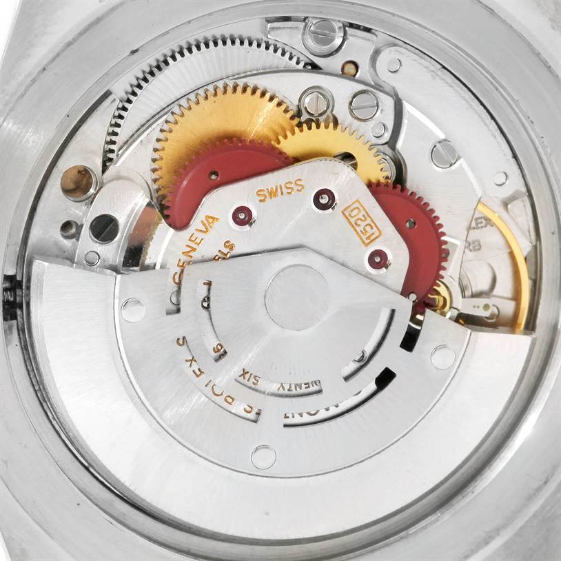 The image shows the internal movement of a Rolex Vintage Collection 5513 Men's Stainless Steel Black Dial 5513 Men's Stainless Steel Black Dial model, highlighting the gears and mechanisms.