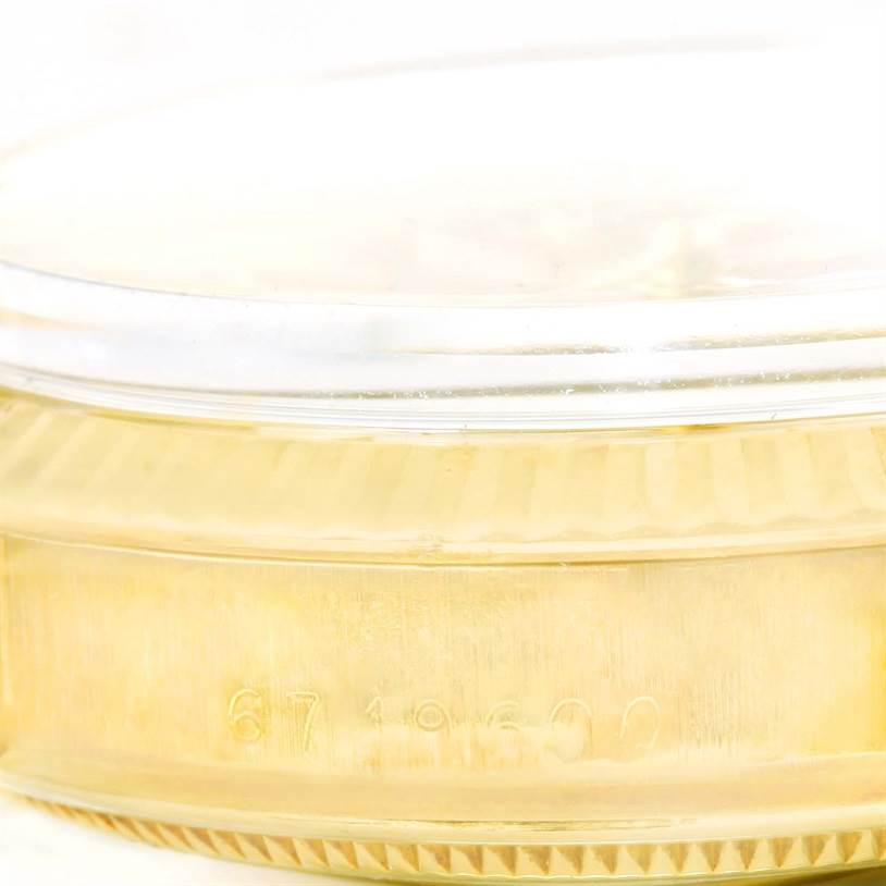 The image shows a close-up of the side of the case with the serial number for a Rolex Vintage Collection 15037 Men's Yellow Gold Silver Dial 15037 Men's Yellow Gold Silver Dial watch.