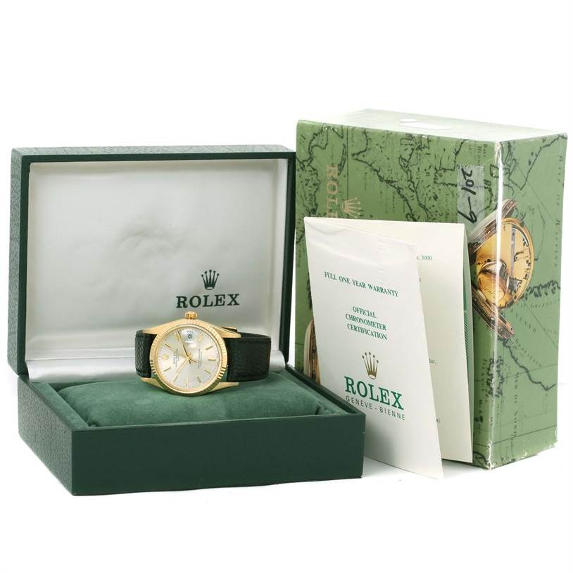 The Rolex Vintage Collection 15037 Men's Yellow Gold Silver Dial 15037 Men's Yellow Gold Silver Dial watch is displayed in an open box, with accompanying warranty and certification papers beside it.