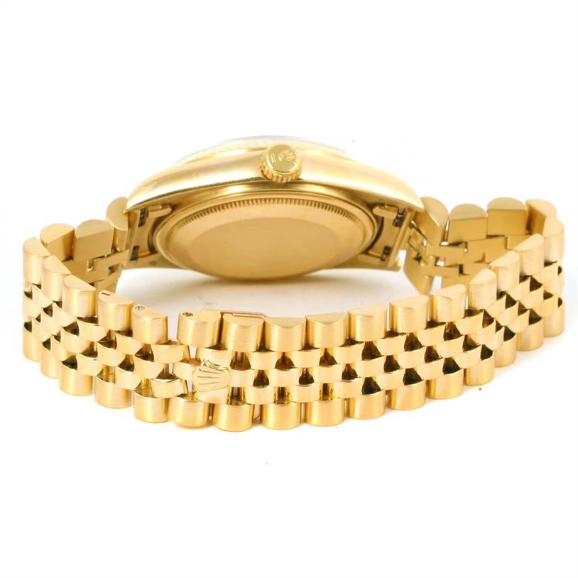 The image shows the back and side of the Rolex Vintage Collection 16018 Men's Yellow Gold Champagne Dial 16018 Men's Yellow Gold Champagne Dial watch, focusing on the case, crown, and bracelet.