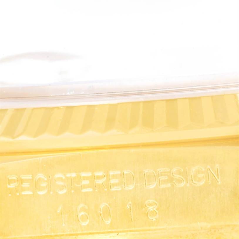 This image shows a close-up of the side of a Rolex Vintage Collection 16018 Men's Yellow Gold Champagne Dial 16018 Men's Yellow Gold Champagne Dial watch, highlighting the "REGISTERED DESIGN 16018" engraving.