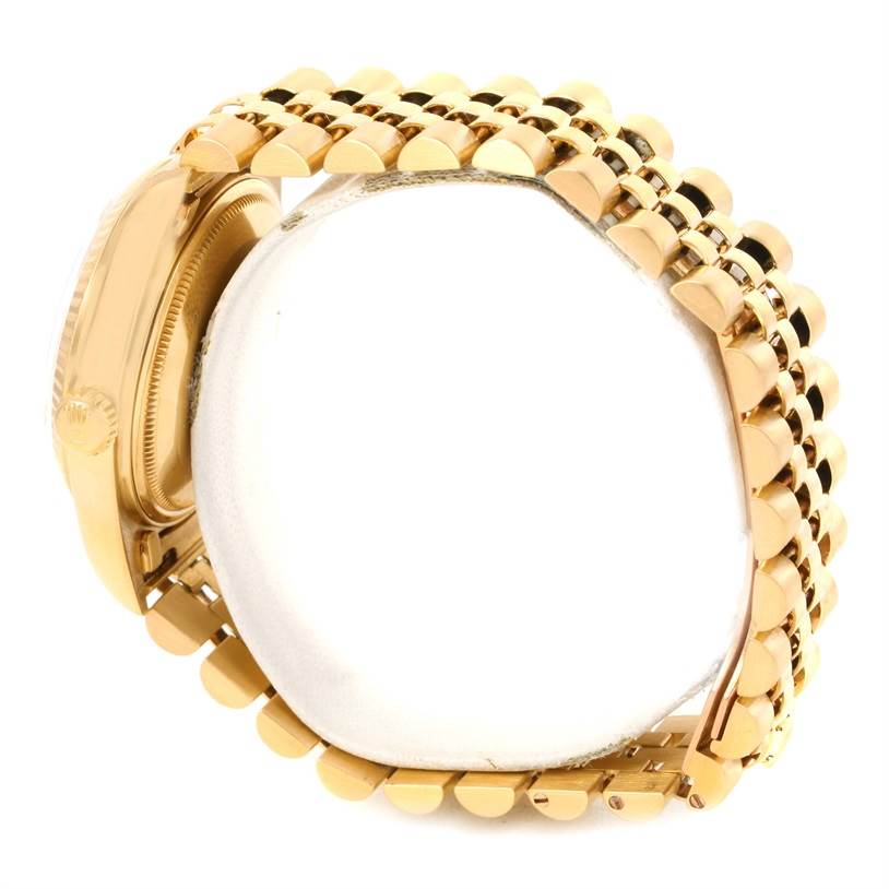 This image shows a side angle of the Rolex Vintage Collection 16018 Men's Yellow Gold Champagne Dial 16018 Men's Yellow Gold Champagne Dial watch, highlighting its gold case and band.