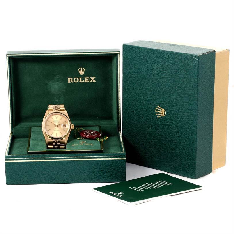The image shows a Vintage Collection Rolex watch in its open box with packaging and warranty cards.