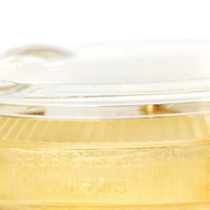 This image shows a close-up of the side of a Rolex Vintage Collection 1503 Men's Yellow Gold Champagne Dial 1503 Men's Yellow Gold Champagne Dial watch, highlighting the model number 1503 and design text.