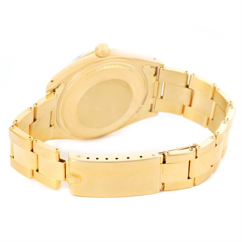 The image shows the back case and bracelet of a Rolex Vintage Collection 1503 Men's Yellow Gold Champagne Dial 1503 Men's Yellow Gold Champagne Dial model from an angle behind the watch.