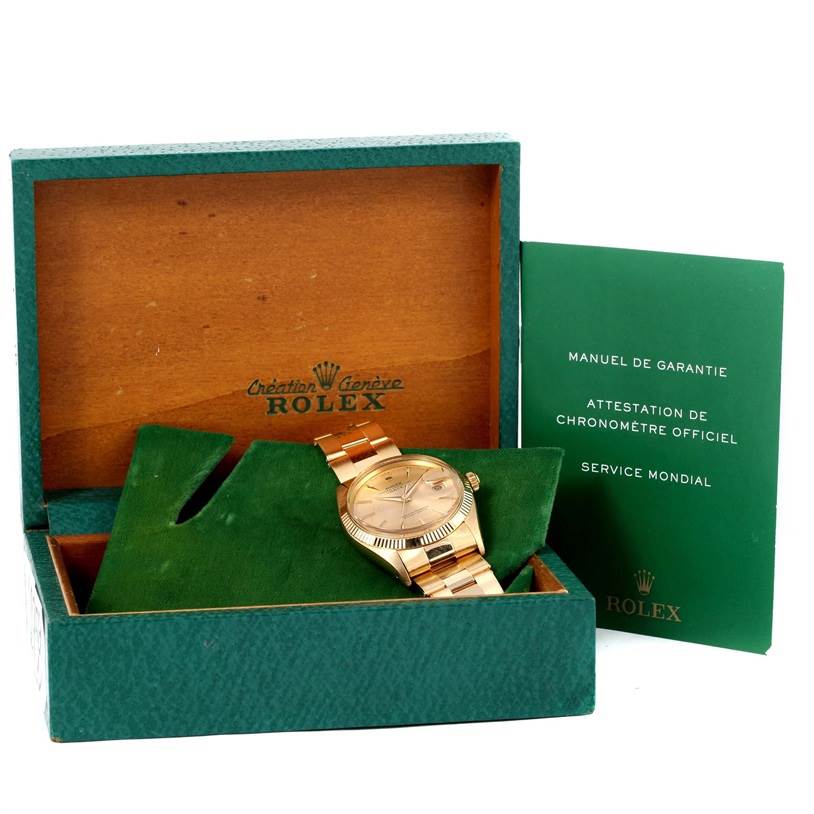 The Vintage Collection Rolex watch is shown in its open box with accompanying manuals, displayed at a slight angle.