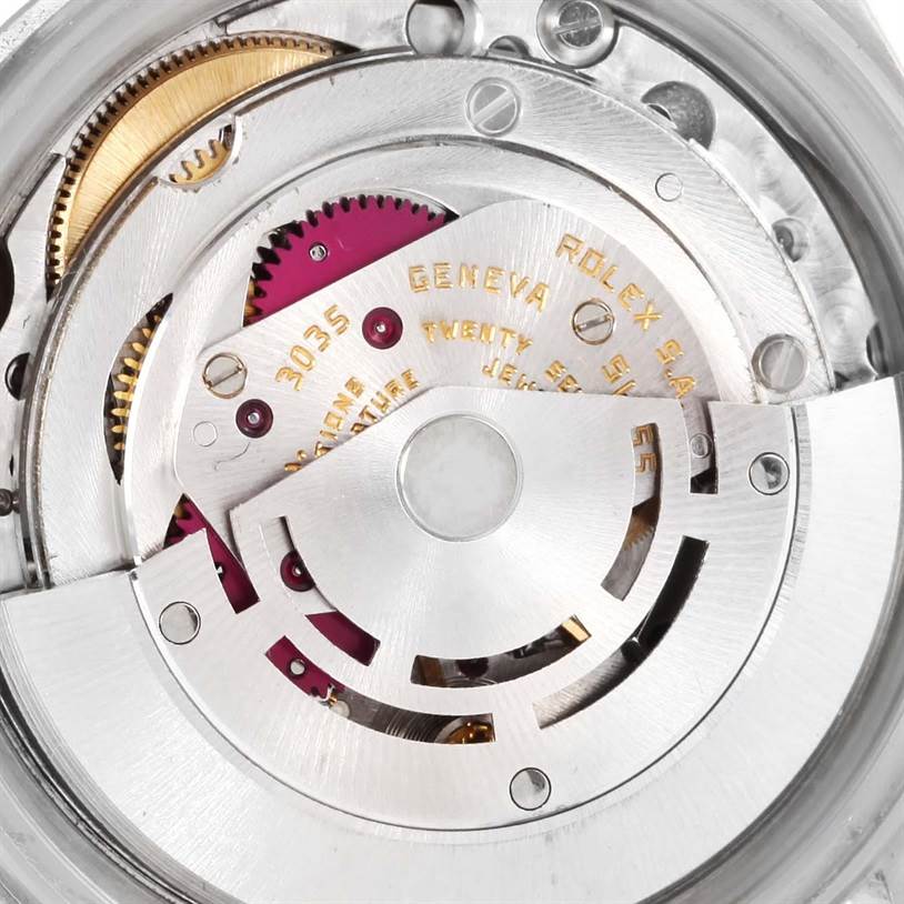 The image shows an angled view of the interior movement parts of the Vintage Collection model by Rolex.