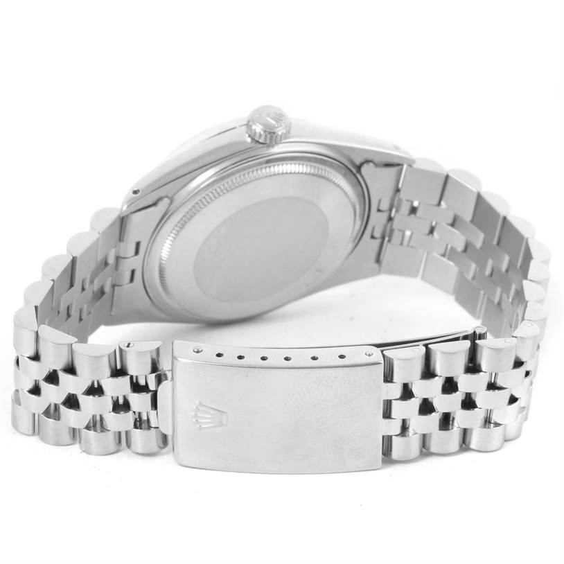 The image shows the backside of the Rolex Vintage Collection 16014 Men's Stainless Steel Silver Dial 16014 Men's Stainless Steel Silver Dial watch, focusing on the case back and metal bracelet clasp.