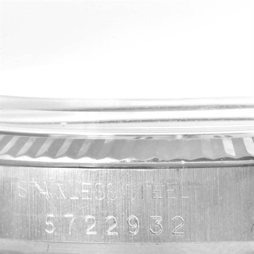 The image shows a close-up of the serial number engraving on the side of the Rolex Vintage Collection 16014 Men's Stainless Steel Silver Dial 16014 Men's Stainless Steel Silver Dial watch, revealing its stainless steel case.