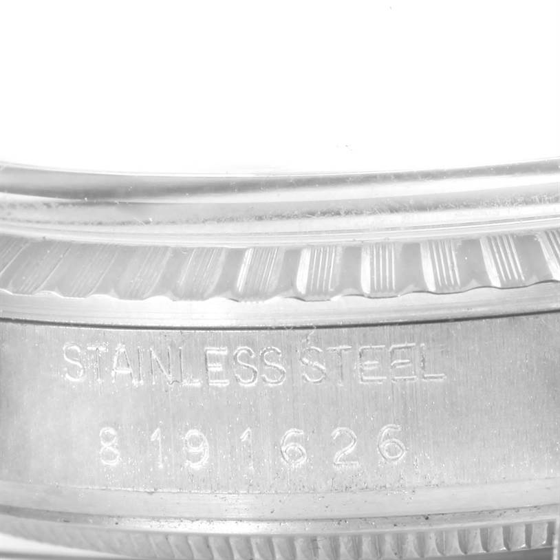 The image shows a close-up of the case and bezel, with serial number engraving, for the Rolex Vintage Collection 16030 Men's Stainless Steel Silver Dial 16030 Men's Stainless Steel Silver Dial watch.