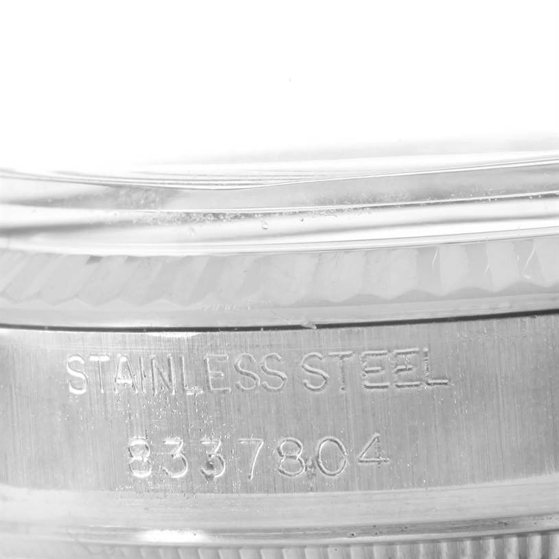 This close-up image shows the stainless steel band and engraved serial number of a Rolex Vintage Collection 16014 Men's Stainless Steel Silver Dial 16014 Men's Stainless Steel Silver Dial watch.